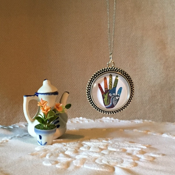 Glass dome hands/necklaces - Hand in Mind