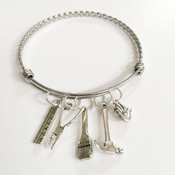 Charm bracelet; girl power carpenter / "Maha Shoukry"