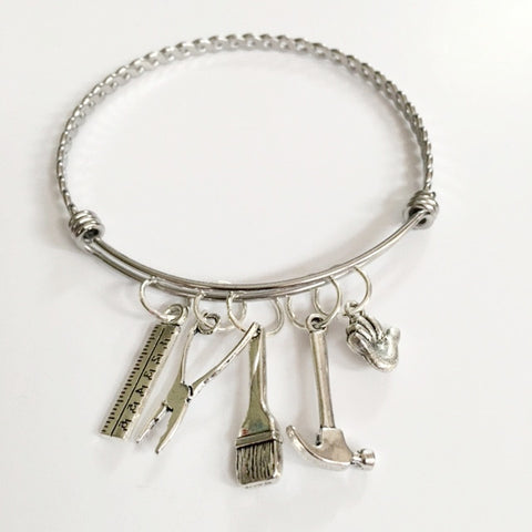 Charm bracelet; girl power carpenter / "Maha Shoukry"