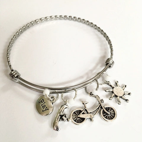 Charm bracelet; fun outdoors theme/ canoe and bike
