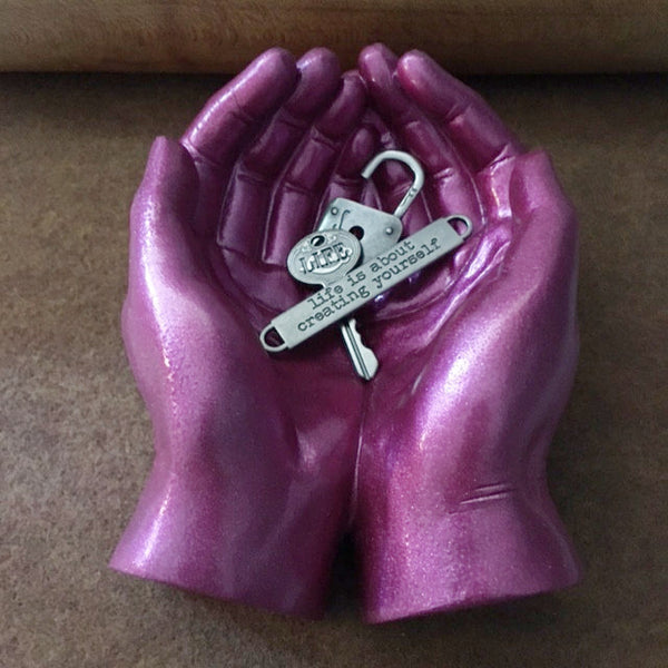 Token Hands/Cupped ceramic hands with token and mat