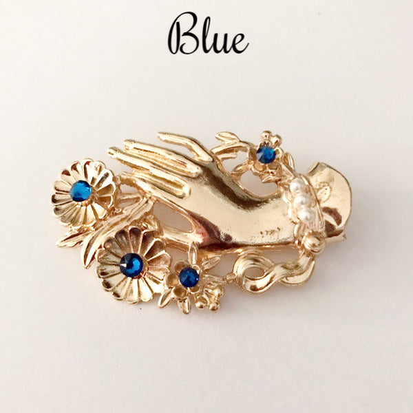 Vintage hand brooch with gem bouquet