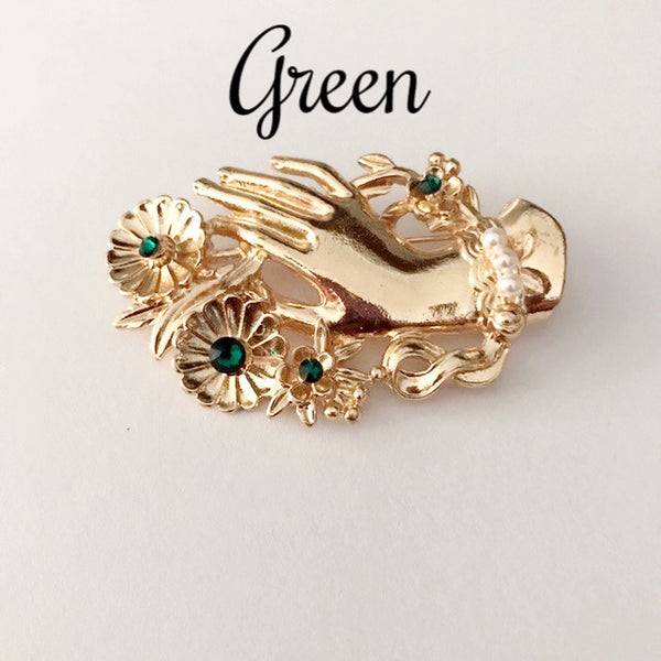 Vintage hand brooch with gem bouquet