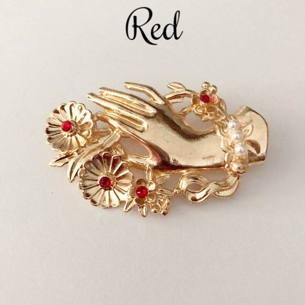 Vintage hand brooch with gem bouquet