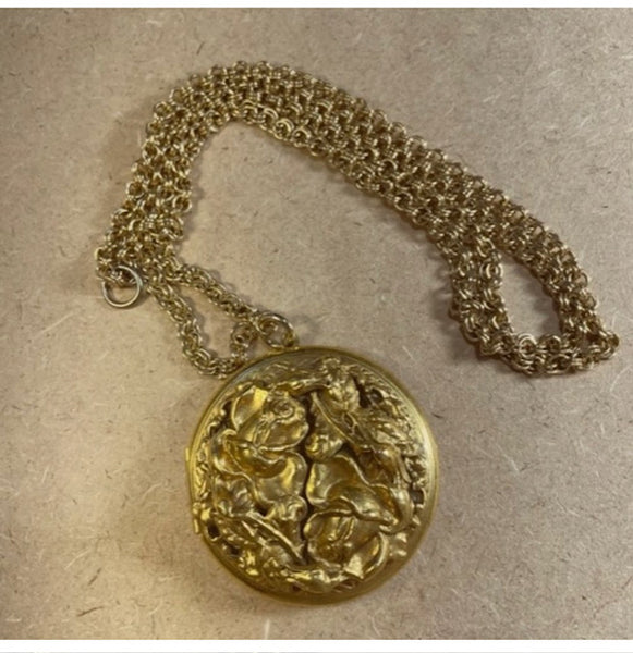 Gold dimensional brooch locket on chain