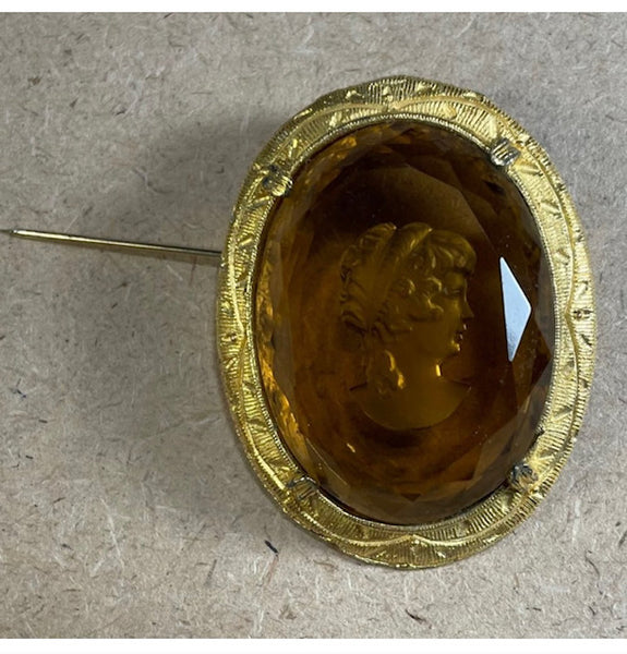 Oval Cameo with amber etched profile