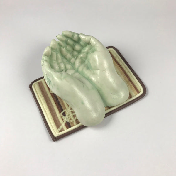 Miniature hands with word token